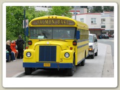 Bus picking up passengers for Salmon Bake