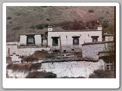 Typical farmhouse with prayer flags in each corner
