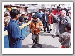 People and vendors by the Jokhang Temple
