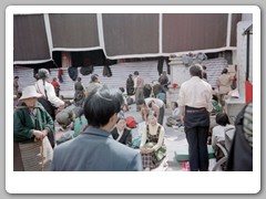 People and vendors by the Jokhang Temple